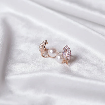 These anti-tarnish earrings have shiny leaf tops and smooth pearls that add a soft glow.