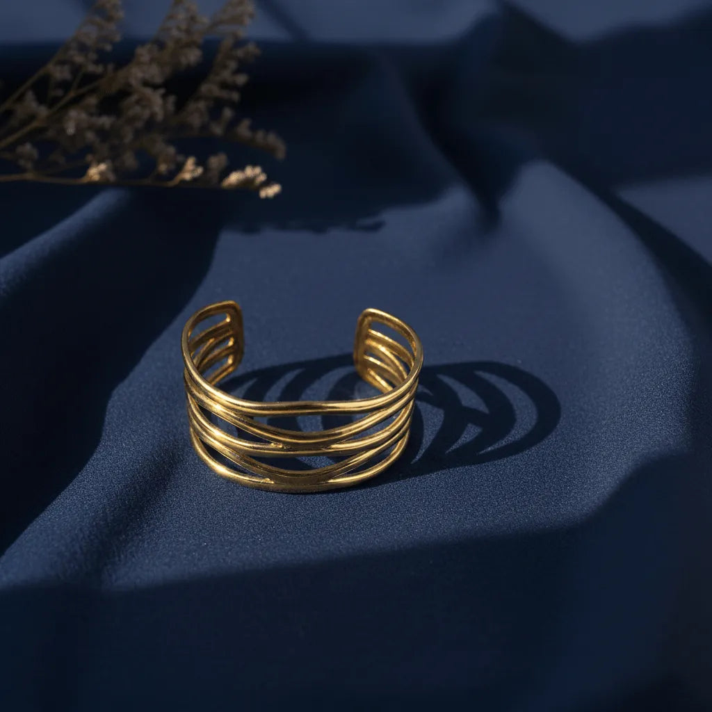 This Golden Spiral Cuff for women, designed with multiple twisted loops that gives a classy look. 