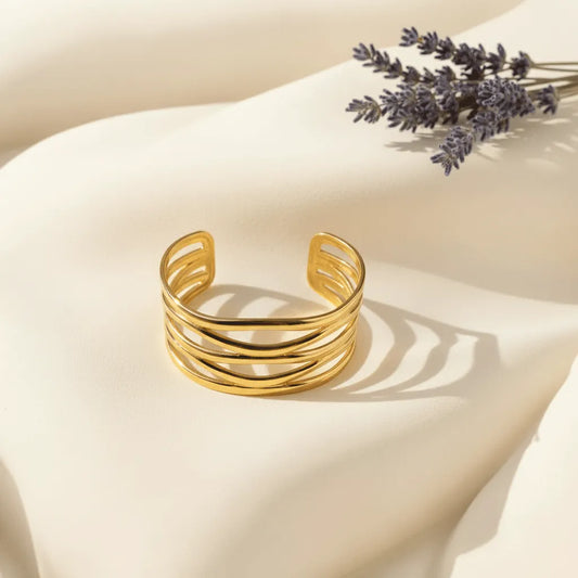 This Golden Spiral Cuff for women, designed with multiple twisted loops that gives a classy look. 