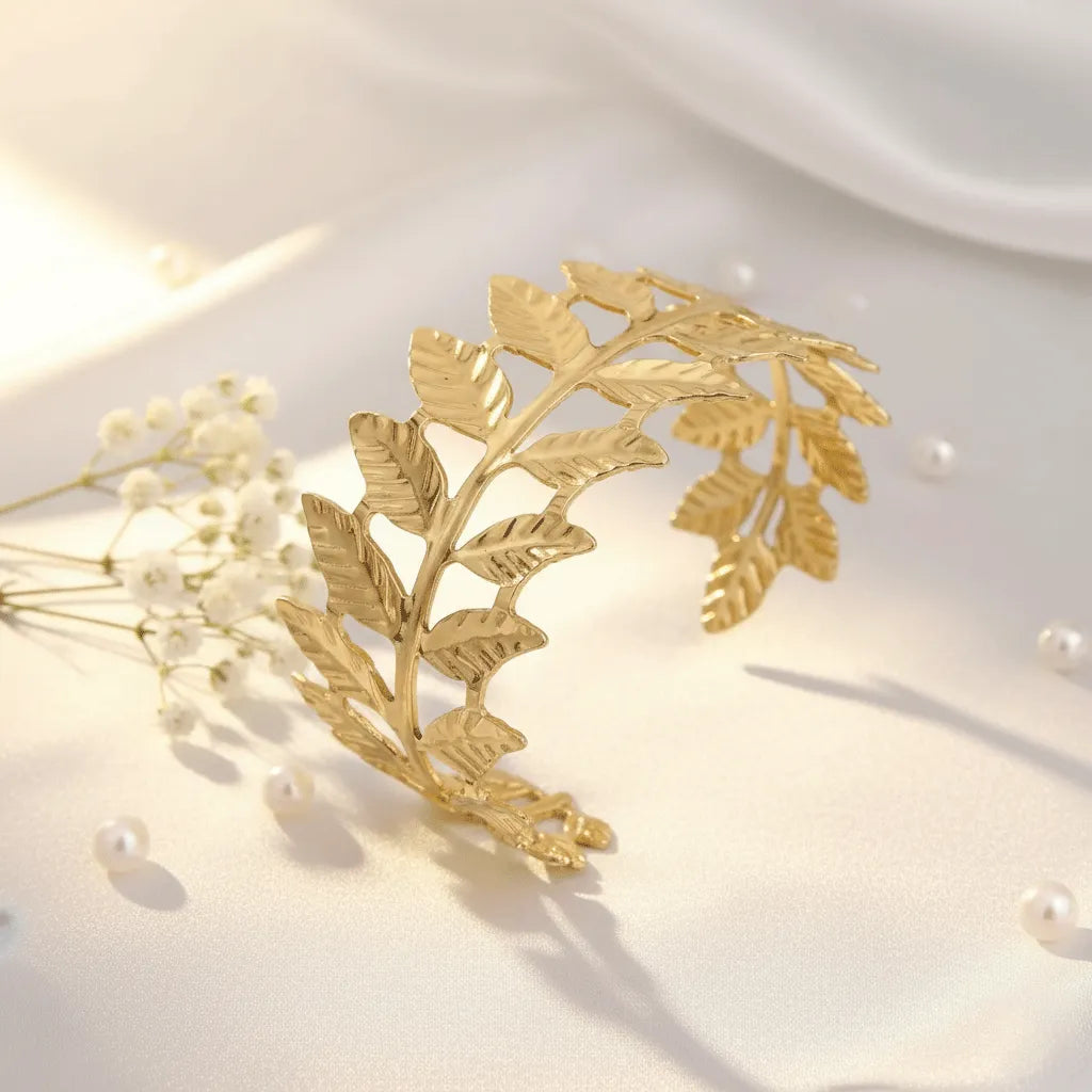 The adjustable Golden Leaf Cuff Bracelet with detailed leaf patterns and a premium gold finish adds a stylish touch to both traditional and western outfits. 