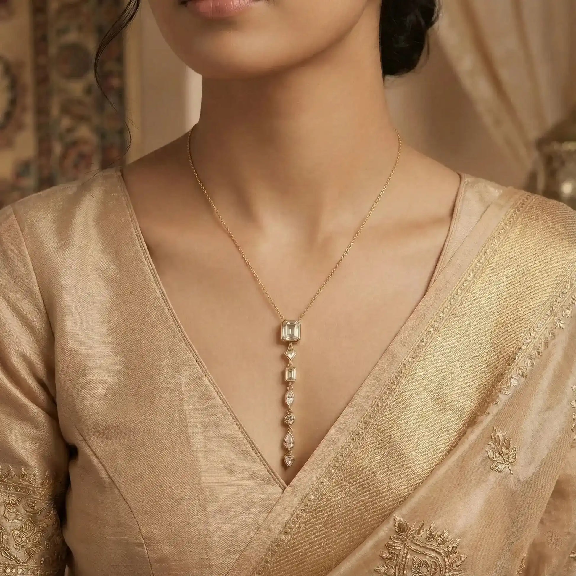 Model wearing gold multi stone line pendant necklace with crystal drops – anti tarnish jewellery for women