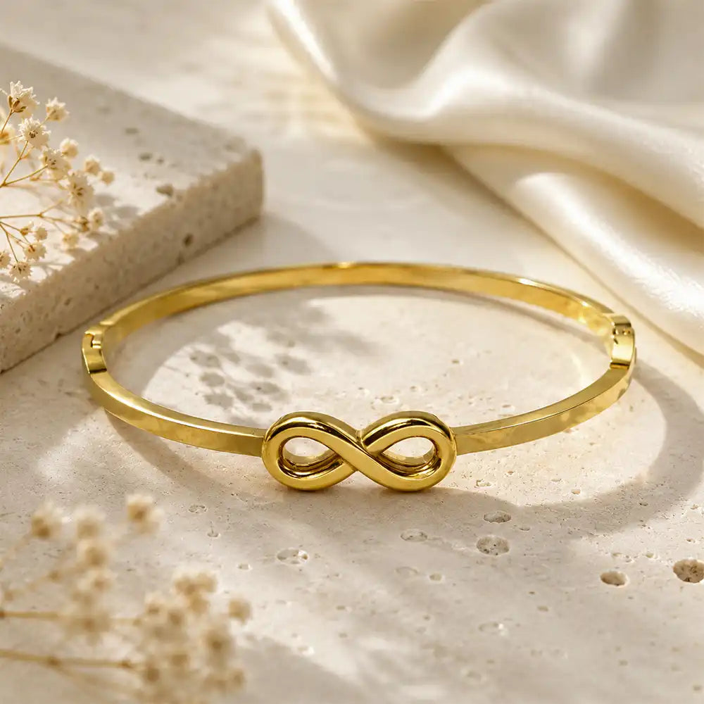Anti tarnish infinity symbol bracelet with luxury beige background