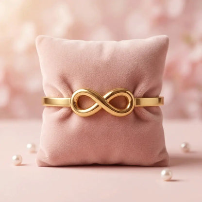 Gold infinity bracelet on soft pink cushion, minimal anti-tarnish kada bracelet for women, elegant everyday jewellry