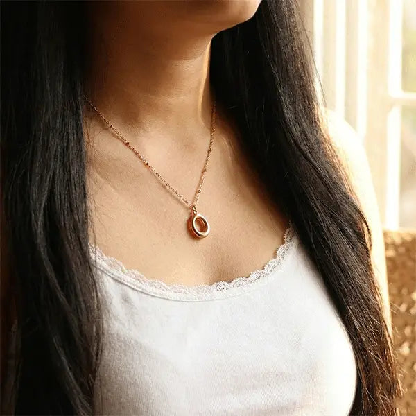 Halo Pendant anti-tarnish oval necklace worn on model, minimal everyday jewellery styled with neutral outfit
