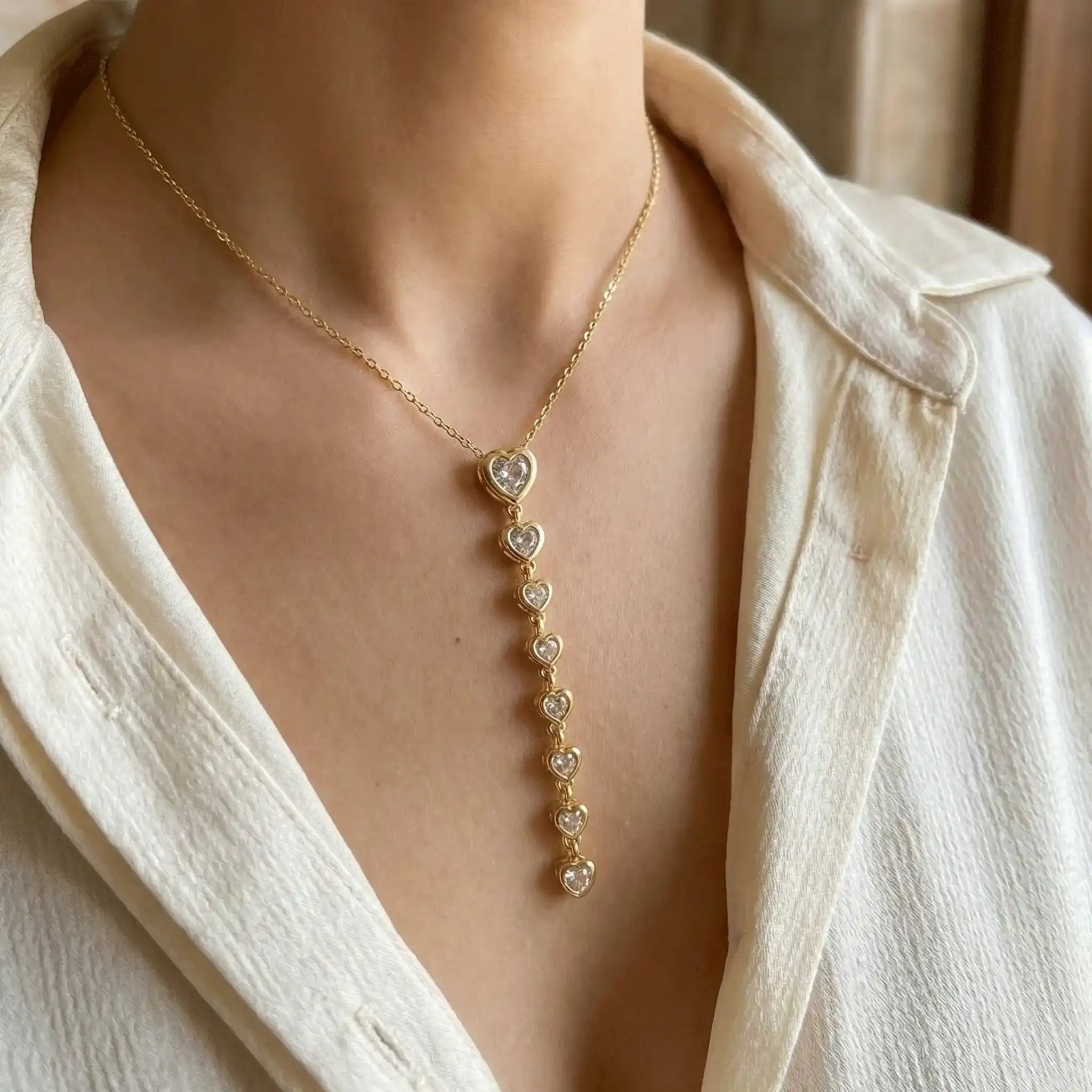 Heart Cascade Pendant anti-tarnish gold heart drop necklace worn close-up