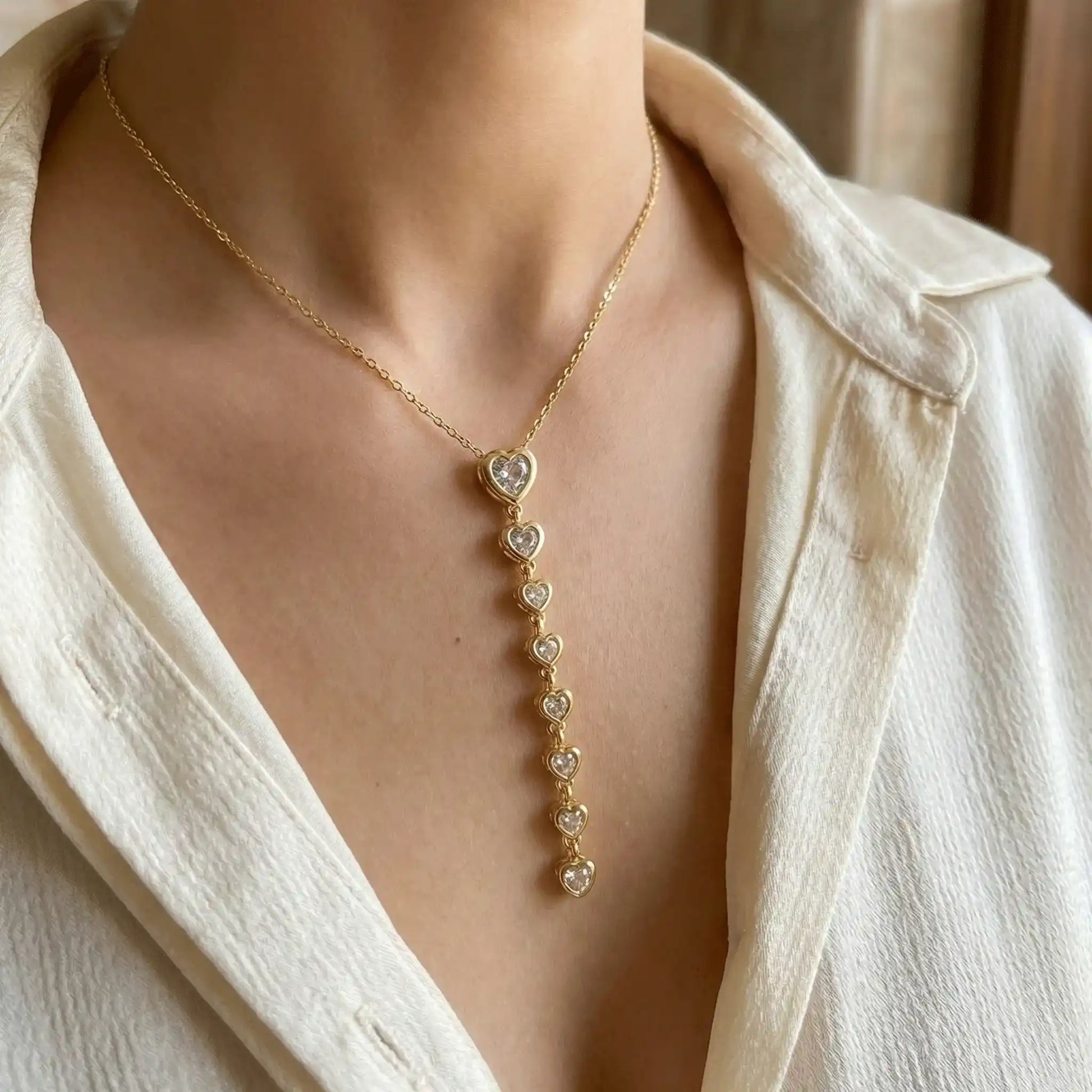 Heart Cascade Pendant anti-tarnish gold heart drop necklace worn close-up