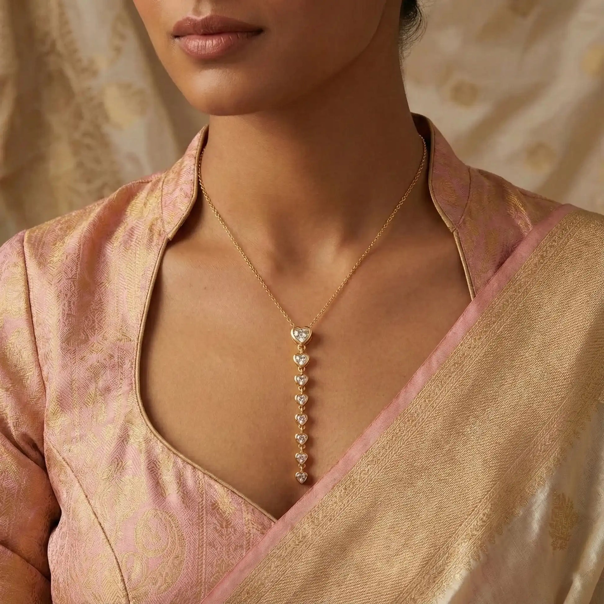 Heart cascade gold pendant necklace styled with saree – elegant anti tarnish jewellery