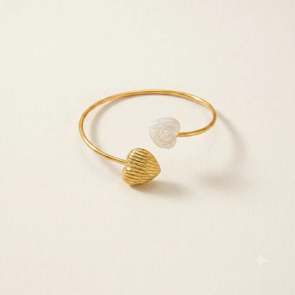 Minimalist Heart Tide anti tarnish brass open cuff bracelet with a textured gold heart and white rose embellishment.