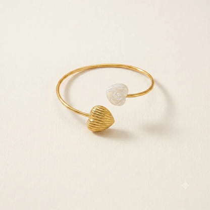 Minimalist Heart Tide anti tarnish brass open cuff bracelet with a textured gold heart and white rose embellishment.