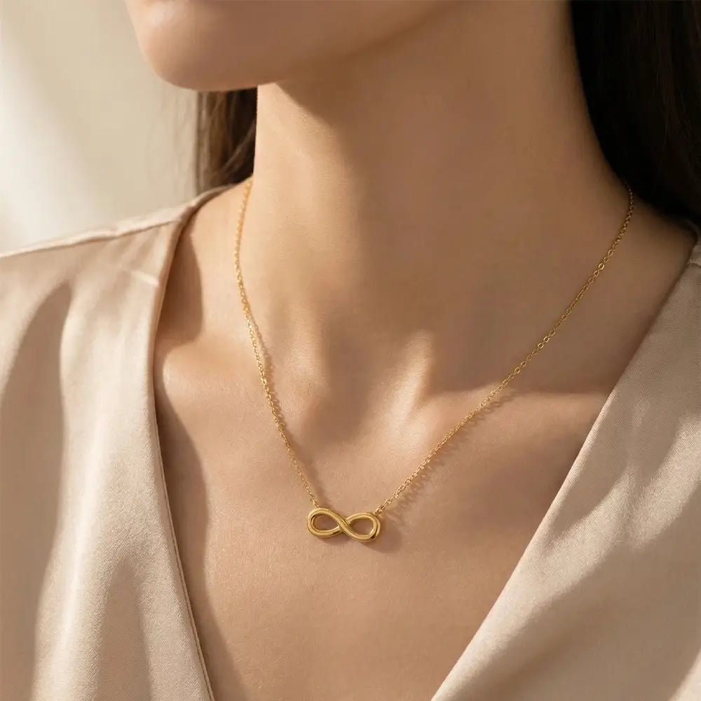 K-A Trends anti tarnish gold infinity pendant necklace worn by female model elegant minimalist lifestyle jewellery look