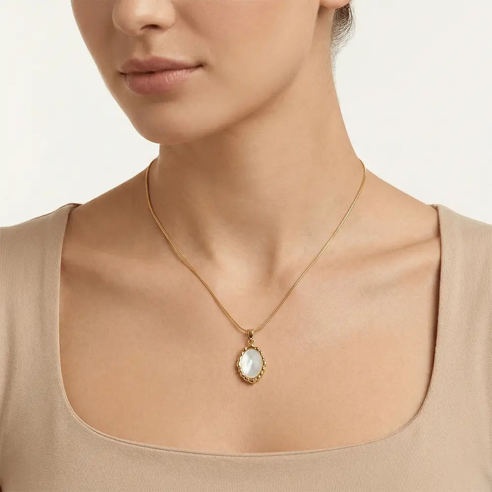 Model wearing ivory frame pendant necklace in polished gold finish, anti tarnish everyday jewellery by K-A Trends