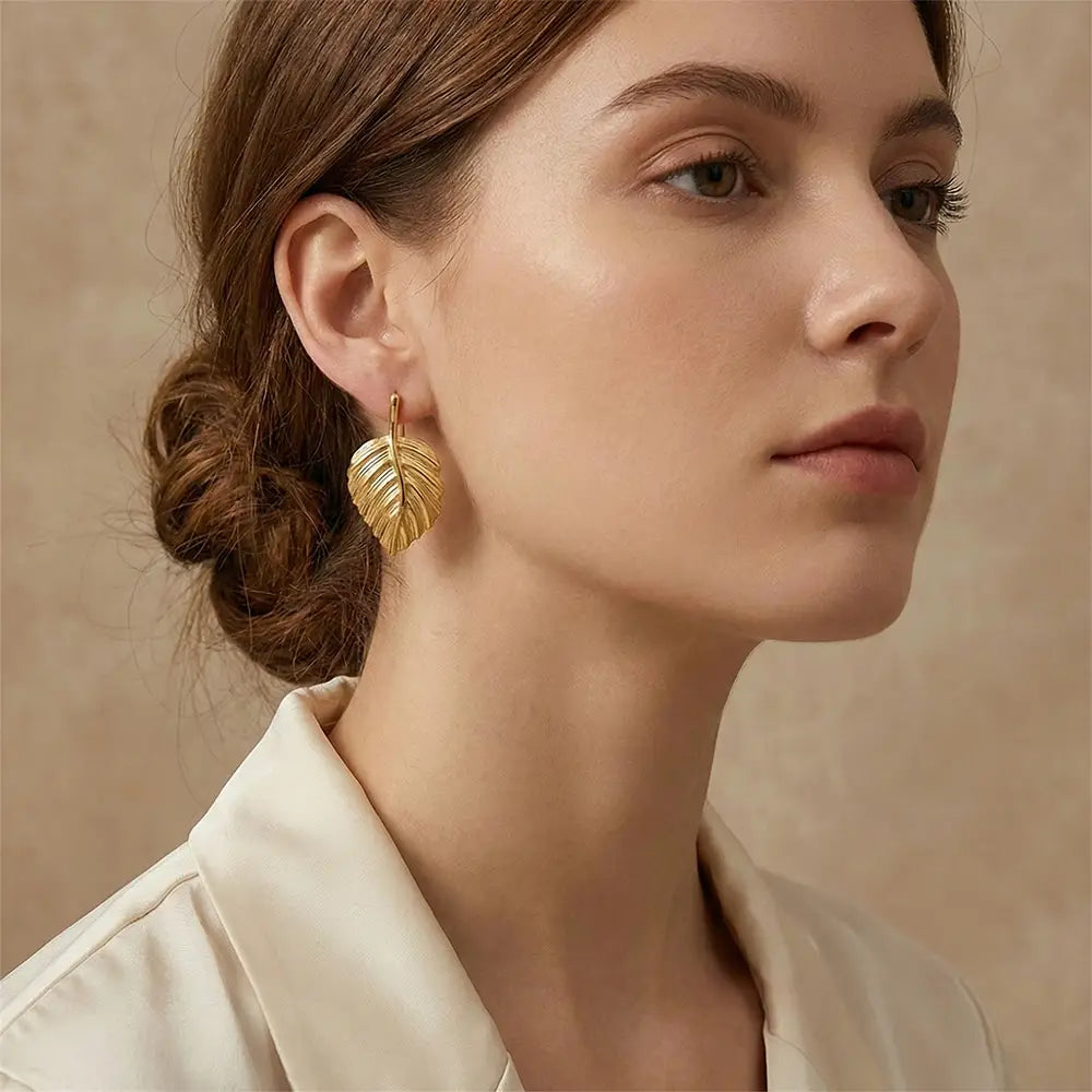K-A Trends anti tarnish gold leaf stud earrings worn by female model elegant minimalist lifestyle jewellery look