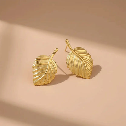 K-A Trends anti tarnish gold leaf stud earrings on beige background premium minimalist jewellery flatlay