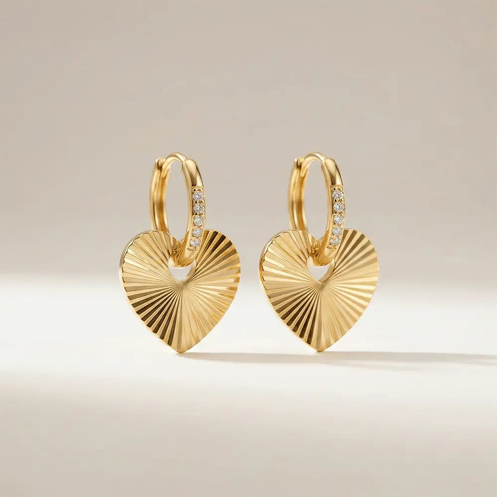 Close up of love hoops heart earrings in polished gold finish, lightweight anti tarnish earrings for women