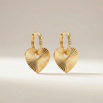 Close up of love hoops heart earrings in polished gold finish, lightweight anti tarnish earrings for women