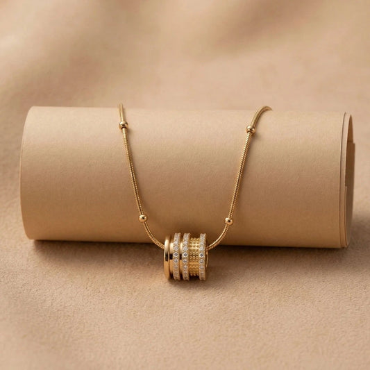 Luxe Cylinder Pendant - Anti-Tarnish on a beige background