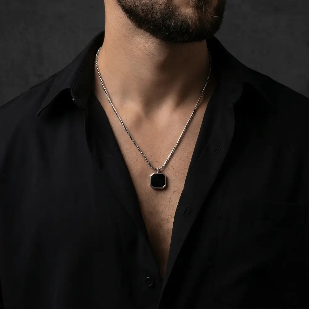 Man wearing modern black and silver anti-tarnish pendant necklace with minimalist geometric design from K-A Trends