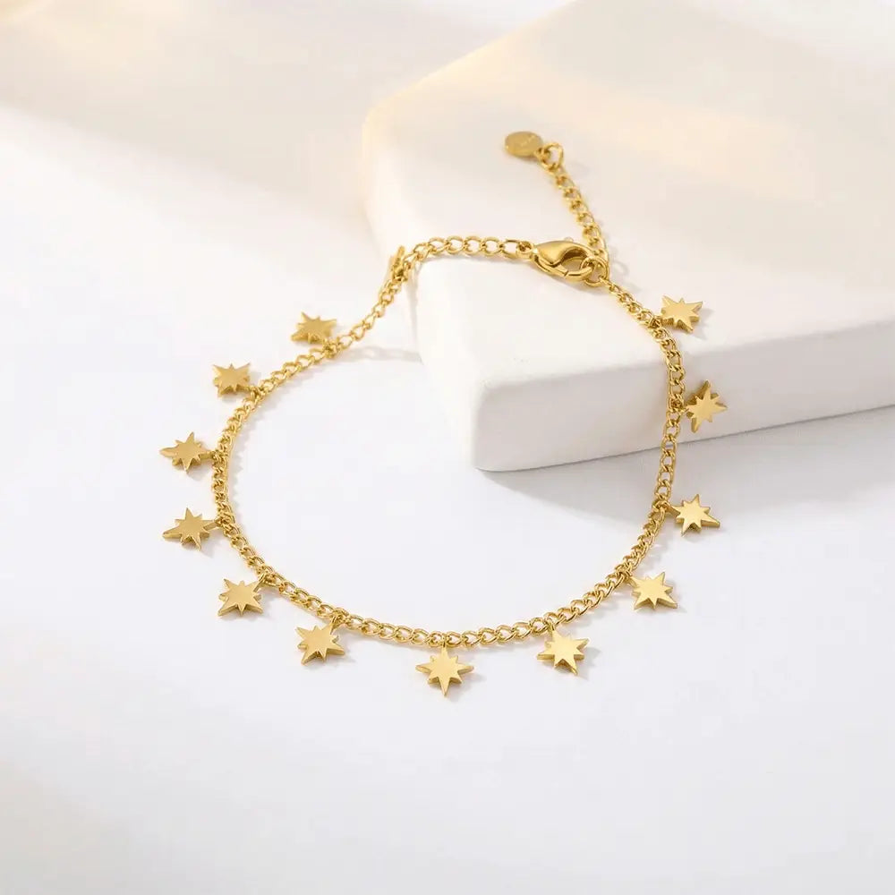Mini star charm bracelet in gold finish on white background, anti tarnish bracelet by K-A Trends
