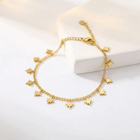 Mini star charm bracelet in gold finish on white background, anti tarnish bracelet by K-A Trends