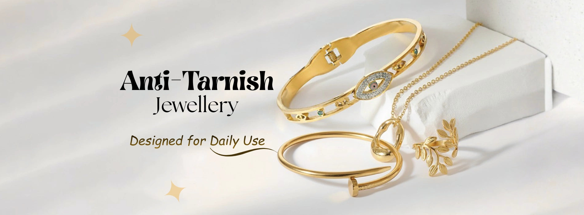 Gold jewelry set with 'Angi Tarnish' branding on a white background