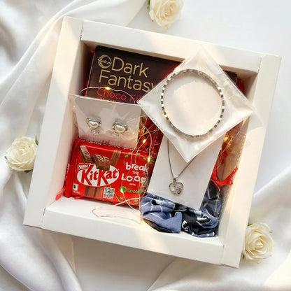 Romantic Valentine gift box with anti-tarnish silver jewelry set, chocolates, LED fairy lights, and elegant white packaging by K-A Trends