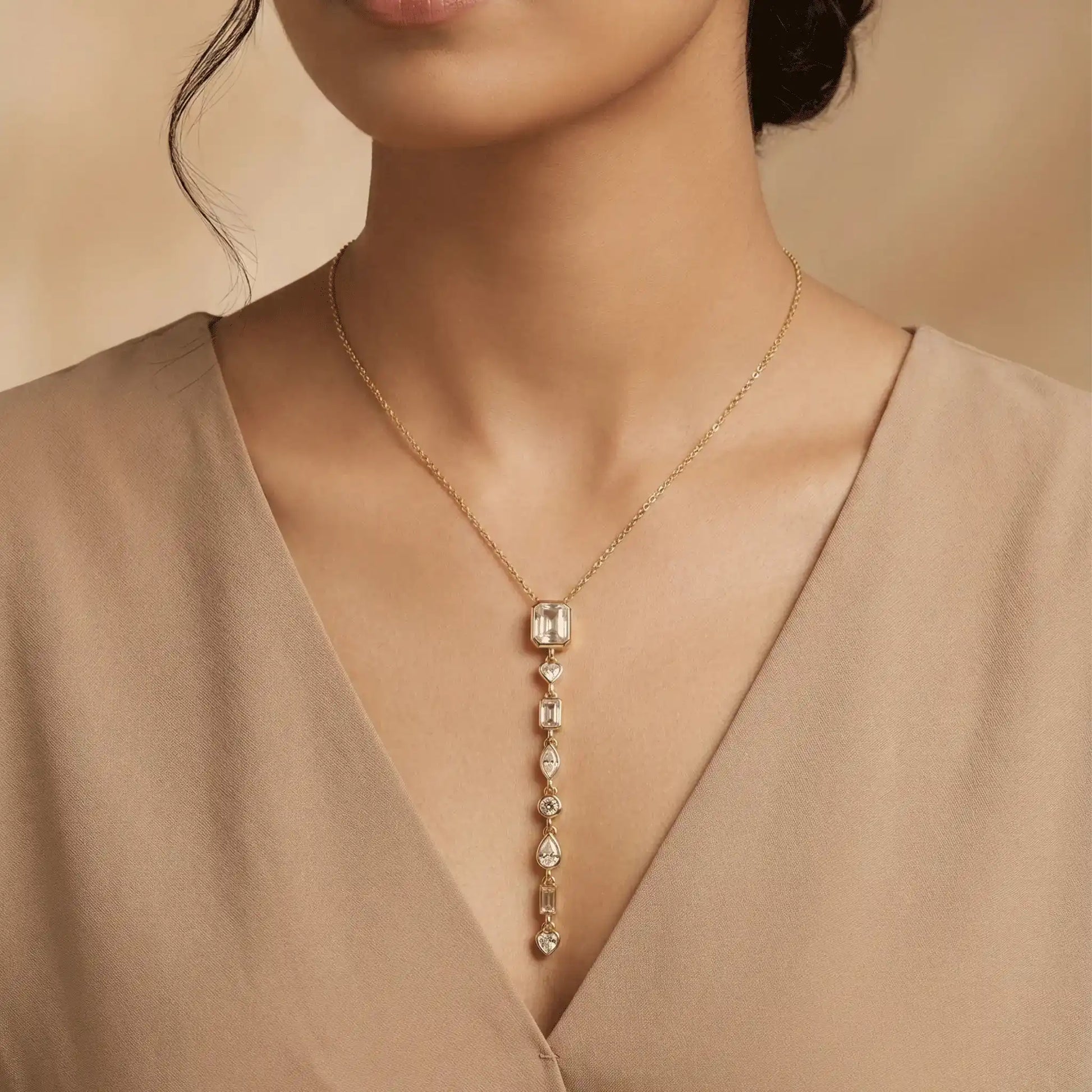 Model wearing gold multi stone vertical pendant necklace – anti tarnish crystal drop necklace for women