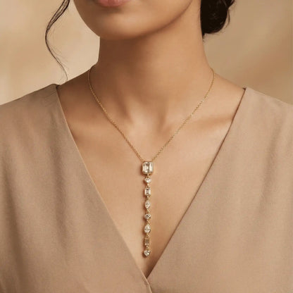 Model wearing gold multi stone vertical pendant necklace – anti tarnish crystal drop necklace for women