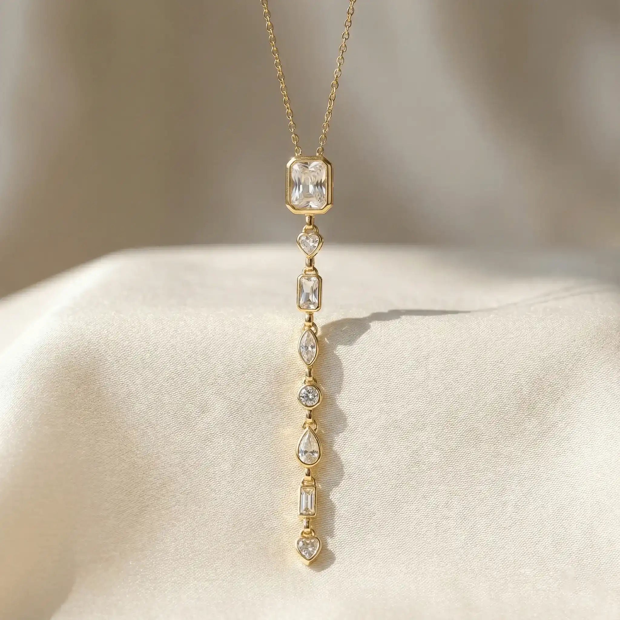 Gold multi stone line pendant with rectangular, heart and teardrop crystals on satin fabric – anti tarnish necklace for women