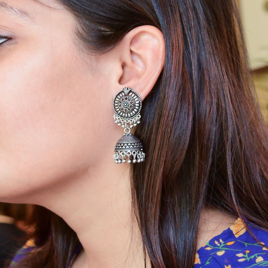 Add a touch of boho charm to your look with these oxidized brass jhumkas