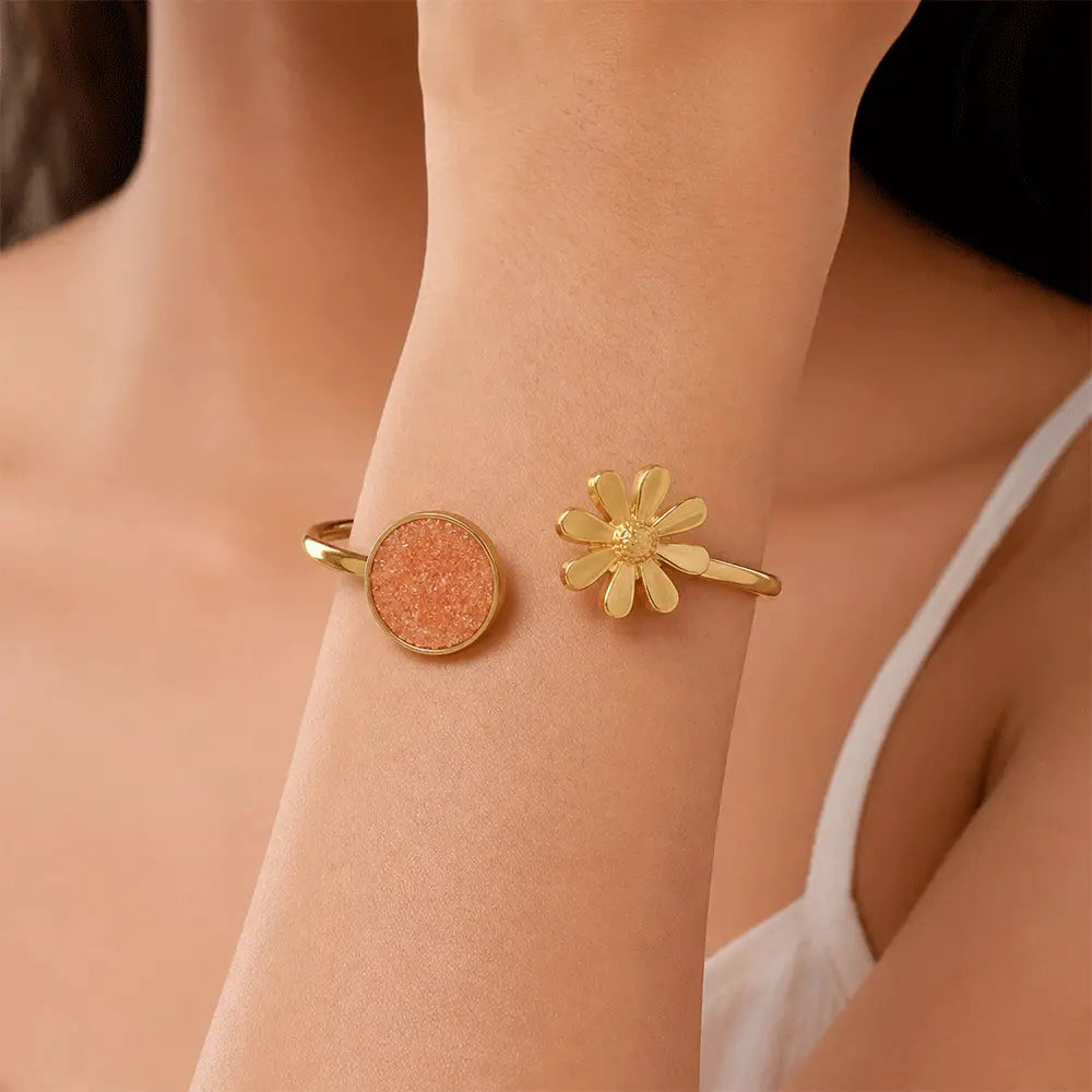 Indian model wearing Peach Blossom anti tarnish brass bracelet featuring a peach druzy stone and daisy flower open cuff design.