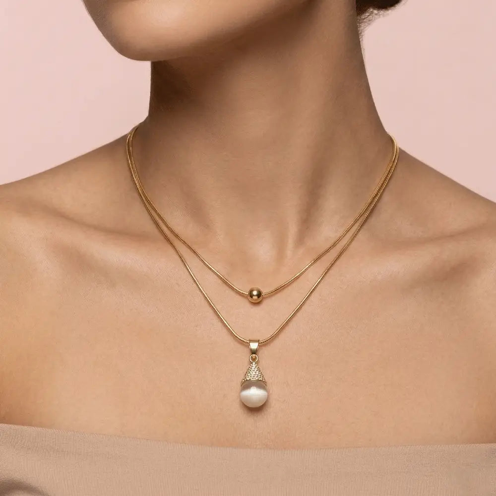 Gold layered pearl teardrop pendant necklace worn by woman, anti-tarnish minimal jewellery by Ka Trends