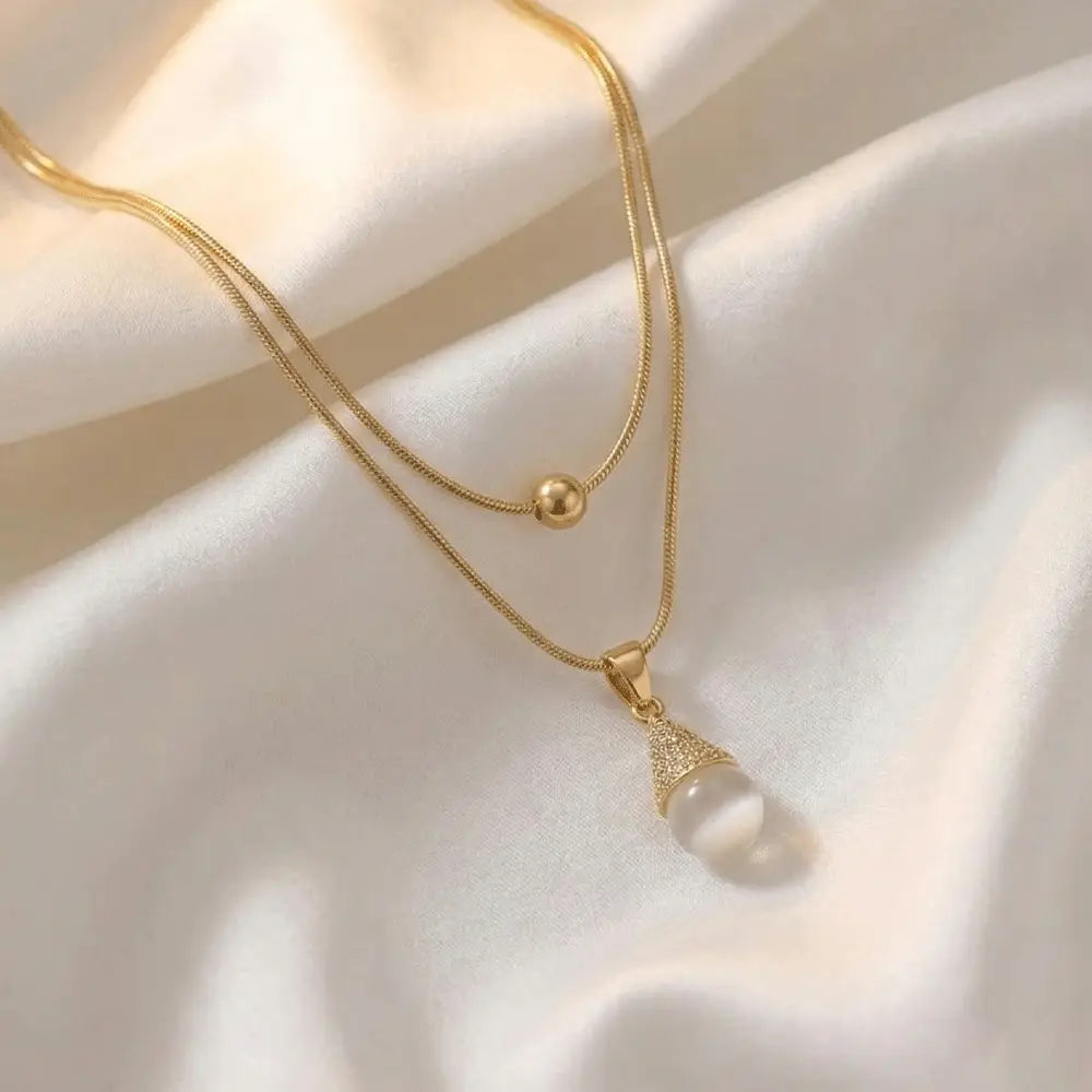 Elegant gold layered necklace with pearl drop pendant on satin fabric, anti-tarnish jewelry for women by Ka Trends
