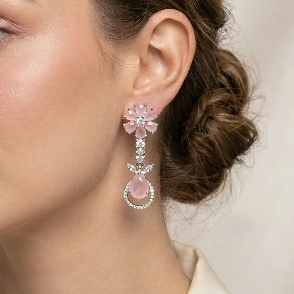 K-A Trends anti tarnish pink floral drop earrings with silver finish and teardrop stone worn by female model elegant close up styling
