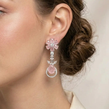 K-A Trends anti tarnish pink floral drop earrings with silver finish and teardrop stone worn by female model elegant close up styling