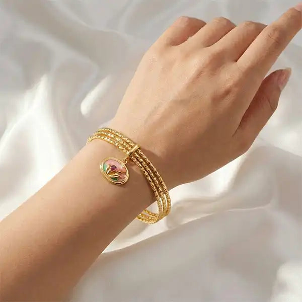 Pink Charm Bangle Bracelet worn on wrist, gold bangles bracelet with floral charm