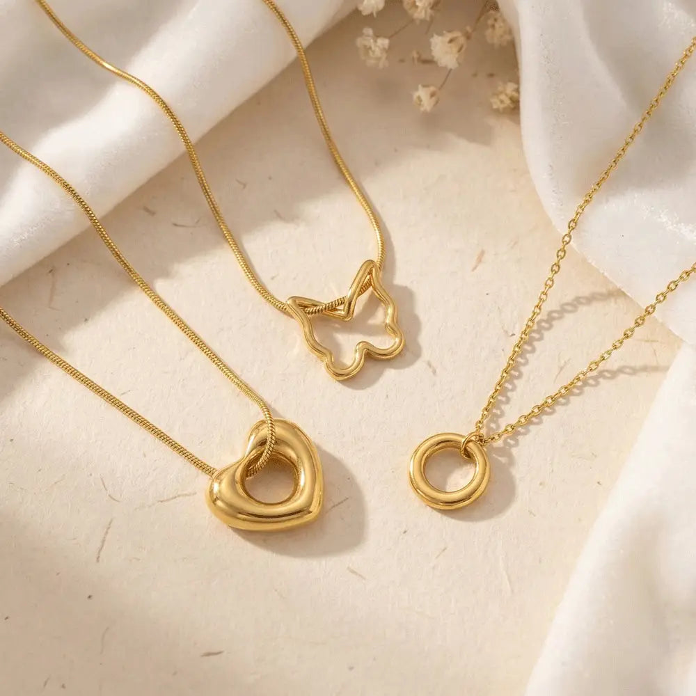 K-A Trends anti tarnish gold minimalist pendant necklace set featuring butterfly pendant, heart pendant and circle pendant delicate jewellery