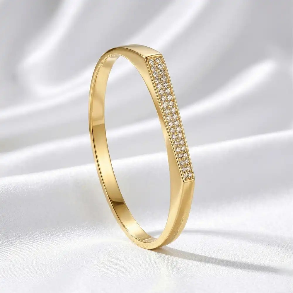 K-A Trends anti-tarnish gold bar bracelet with crystal detailing on soft fabric background