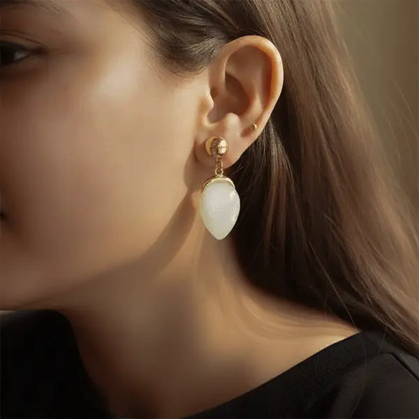 model wearing earrings, pearl drop earrings, gold stud earrings, lightweight jewellery, anti-tarnish earrings