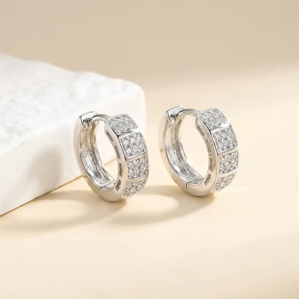 Close up of silver AD bali hoops in polished finish with cubic zirconia stones, lightweight anti tarnish earrings