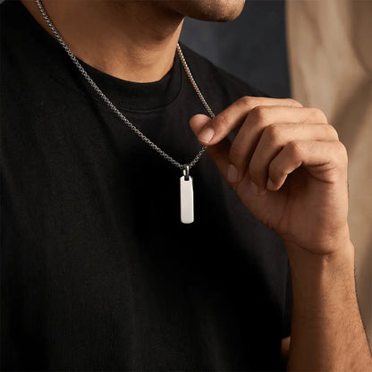 Man wearing elegant silver bar pendant necklace with stainless steel chain and minimalist anti-tarnish design by K-A Trends