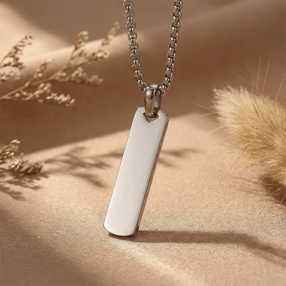 Minimalist silver stainless steel bar pendant necklace with luxury neutral aesthetic from K-A Trends