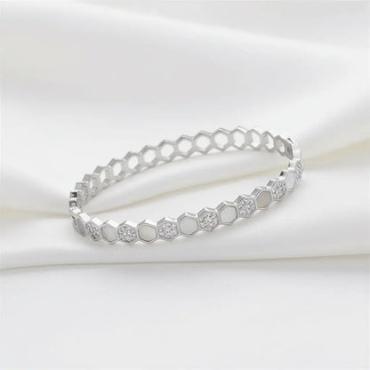Minimal silver hexagon bracelet with crystal charms on white satin background – anti-tarnish women’s jewellery by K-A Trends.