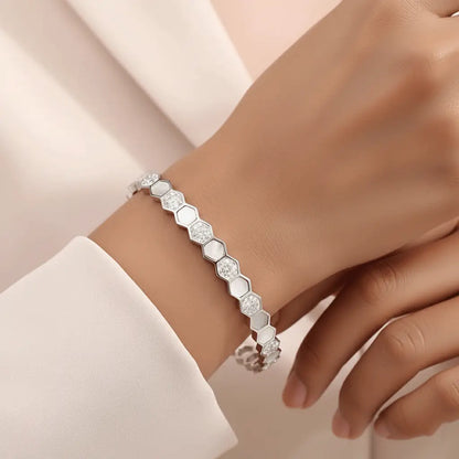 Silver hexagon charm bracelet with crystal detailing worn on wrist – elegant women’s fashion jewellery by K-A Trends.