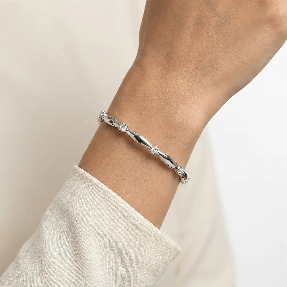 Model wearing silver knot AD bangle with crystal detailing, anti tarnish bracelet for women by K-A Trends