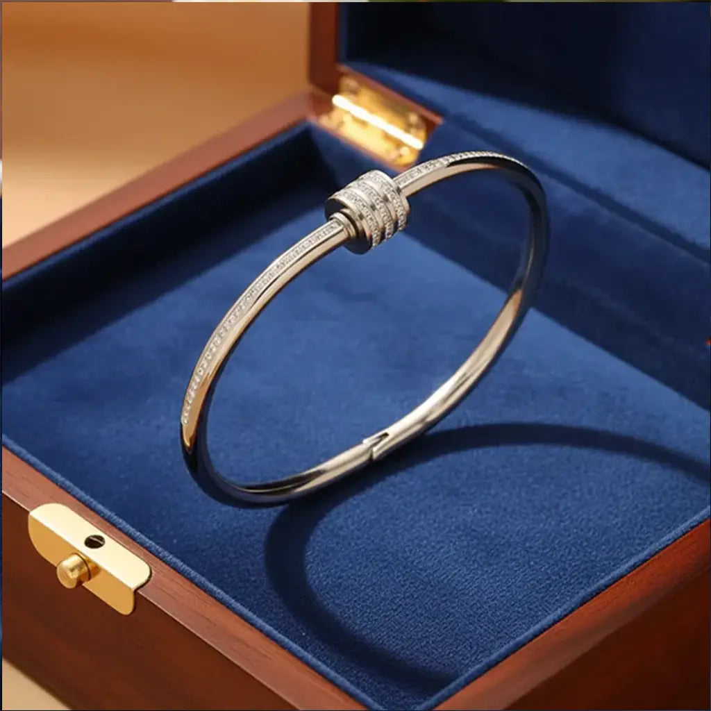 Premium silver anti-tarnish bangle bracelet with triple-ring charm placed in blue velvet jewellery box – K-A Trends.