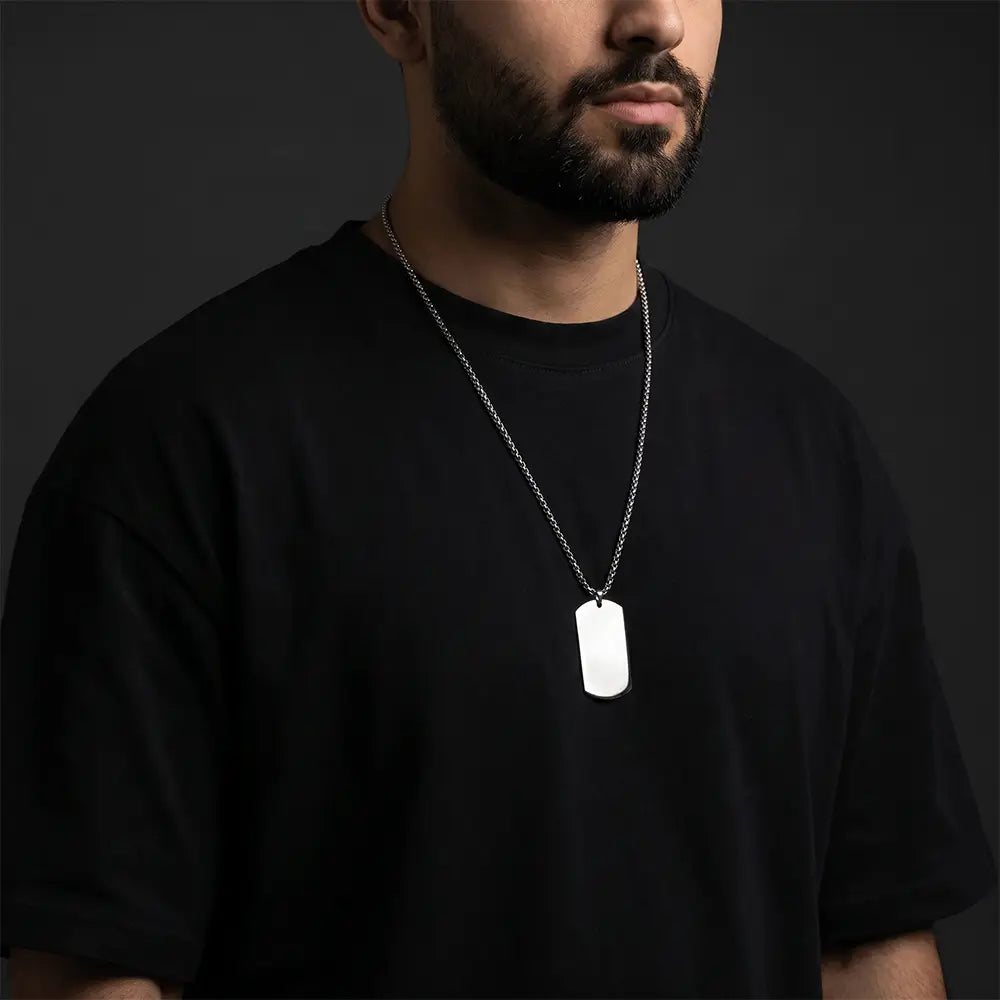 Man wearing minimalist silver tag pendant necklace with stainless steel chain and anti-tarnish finish by K-A Trends