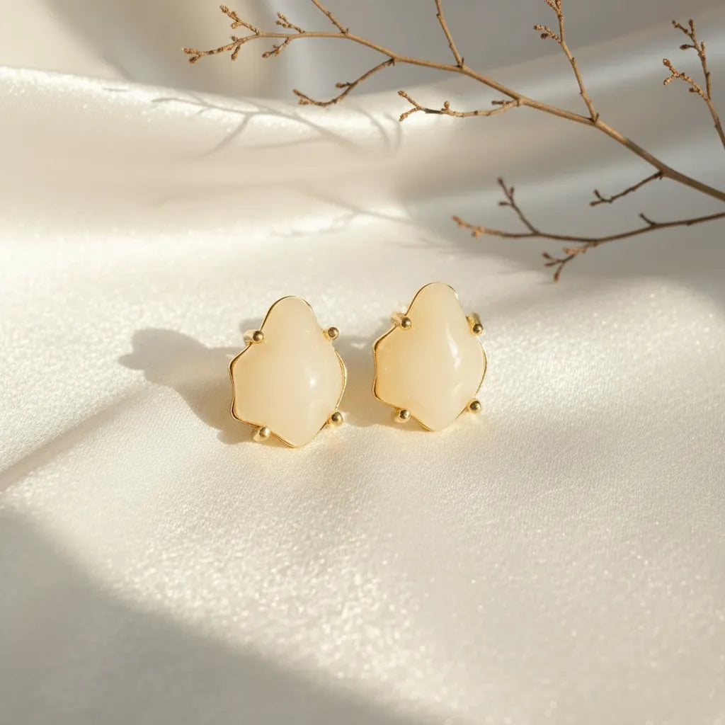 Soft Glow Studs by Ka Trends placed on white satin under natural sunlight with a minimal dried branch — elegant anti-tarnish earrings product photo