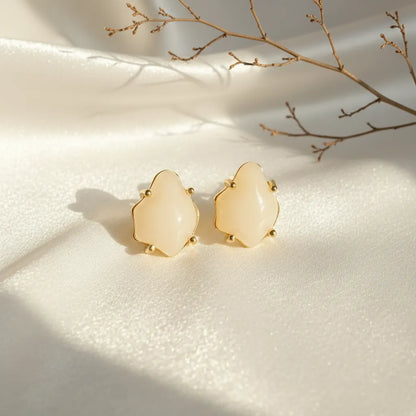 Soft Glow Studs by Ka Trends placed on white satin under natural sunlight with a minimal dried branch — elegant anti-tarnish earrings product photo
