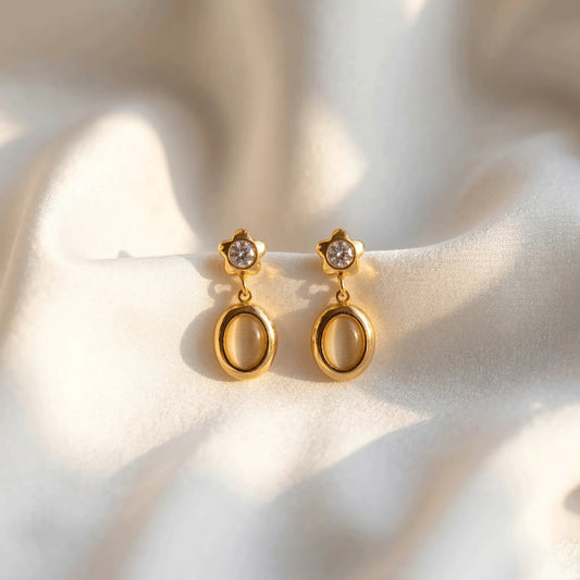 Star Spark Oval Drops with a star design on a soft white background