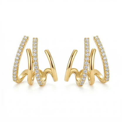 Triple spike AD stud earrings displayed on a plain white background, featuring three curved bars with one lined in sparkling stones.